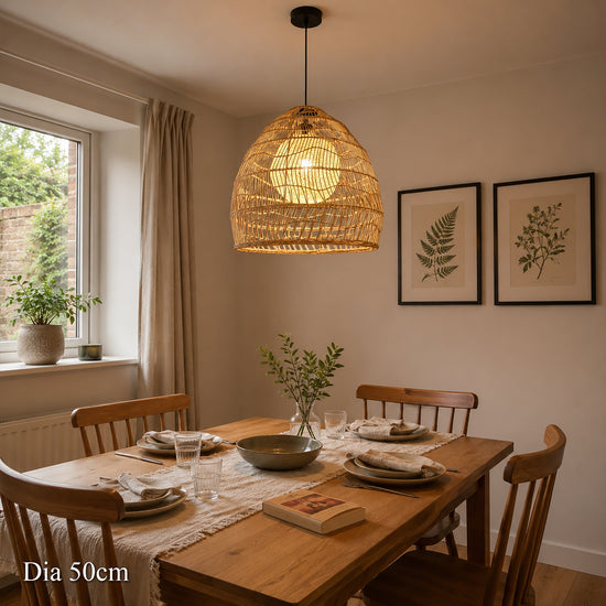 50cm rattan pendant light with inner sphere above a wooden dining table